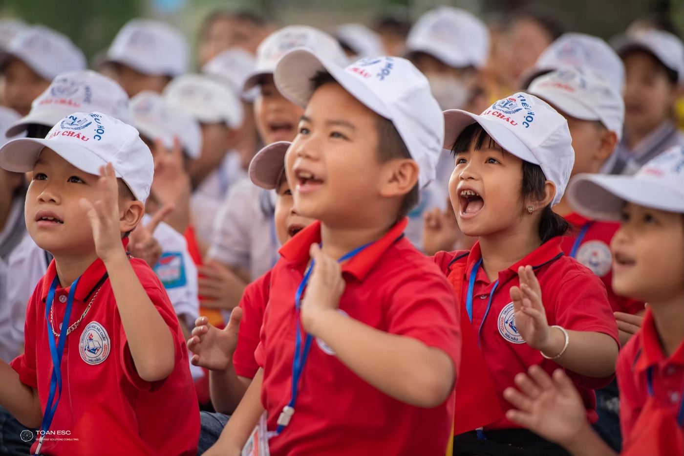 CIFE students in school uniforms and caps