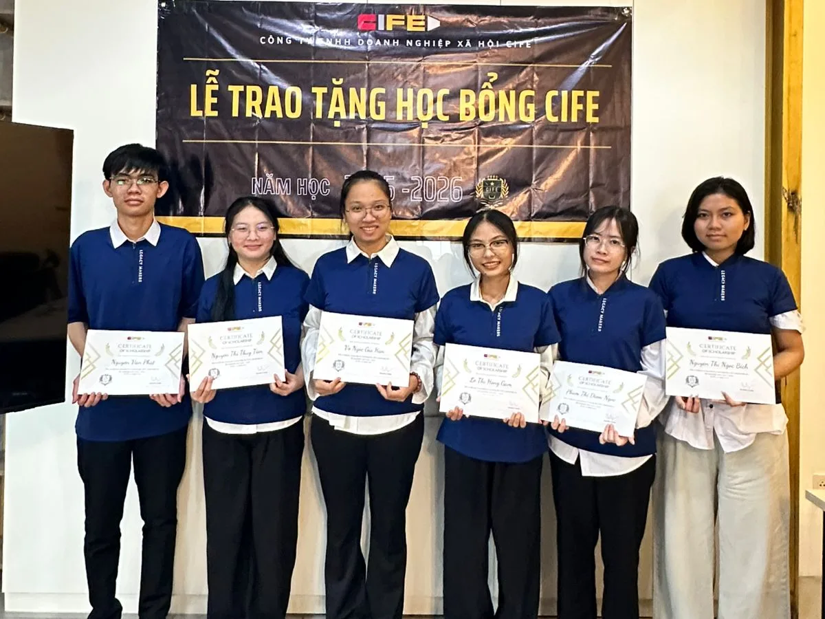 The 2025–26 CIFE scholarship recipients holding their certificates at the award ceremony in Ho Chi Minh City