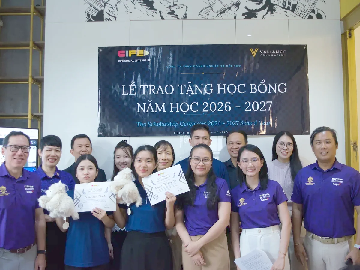 Scholarship recipients and the Valiance Foundation team with certificates beneath the 2026 to 2027 scholarship ceremony banner